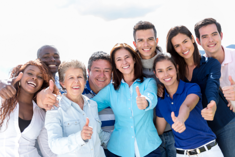 a diverse group of people give happy thumbs up